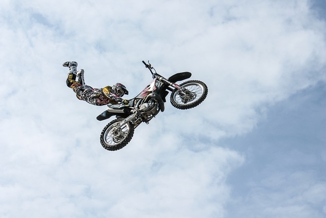 extreme sport bike rider jumping in air with his bike